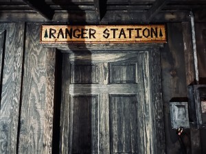 A wooden shack labeled, "Ranger Station" in a wooden sign.