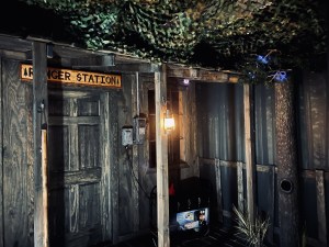 A wood ranger station shack in the forest.