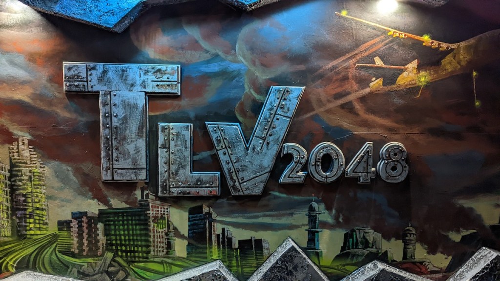 A painting of a post-apolyptic scene, with "TLV2048" in a dramatic font with a metal look.