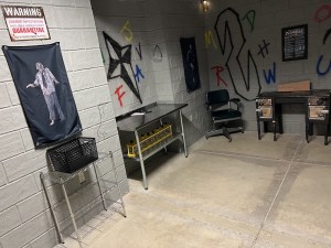 Wide angle view of a concrete bunker covered in graffiti.