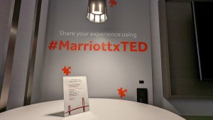 A wall painted with, "Share your experience using #MarriottxTED"