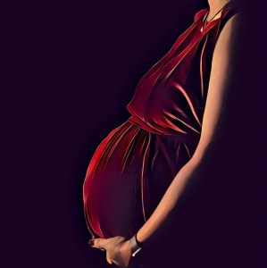 A pregnant woman in a red dress holding her belly.