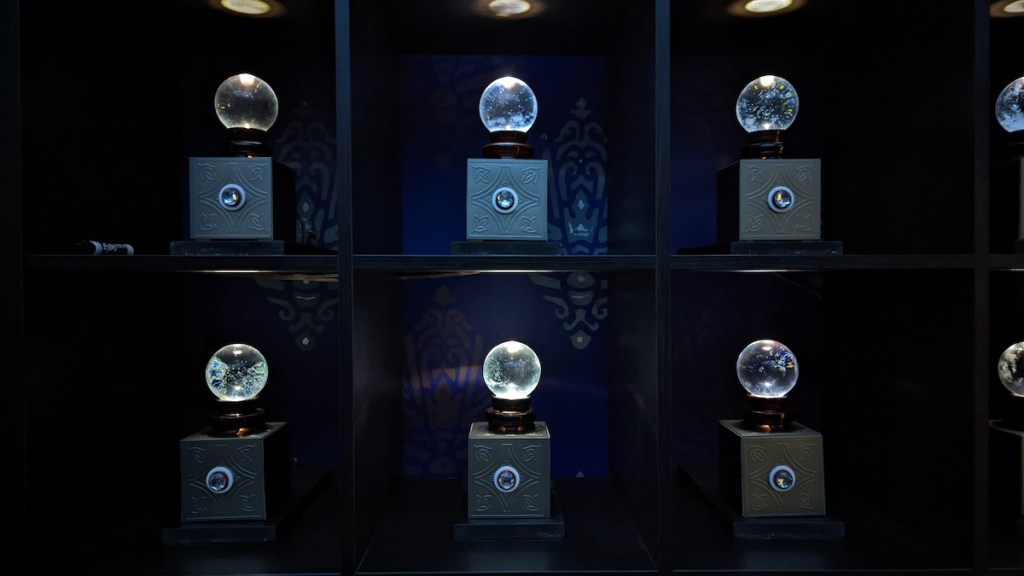 A wall of crystal balls, dramatically lit.