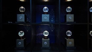 A wall of crystal balls, dramatically lit.