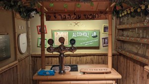 A tiki bar with a beer tap.