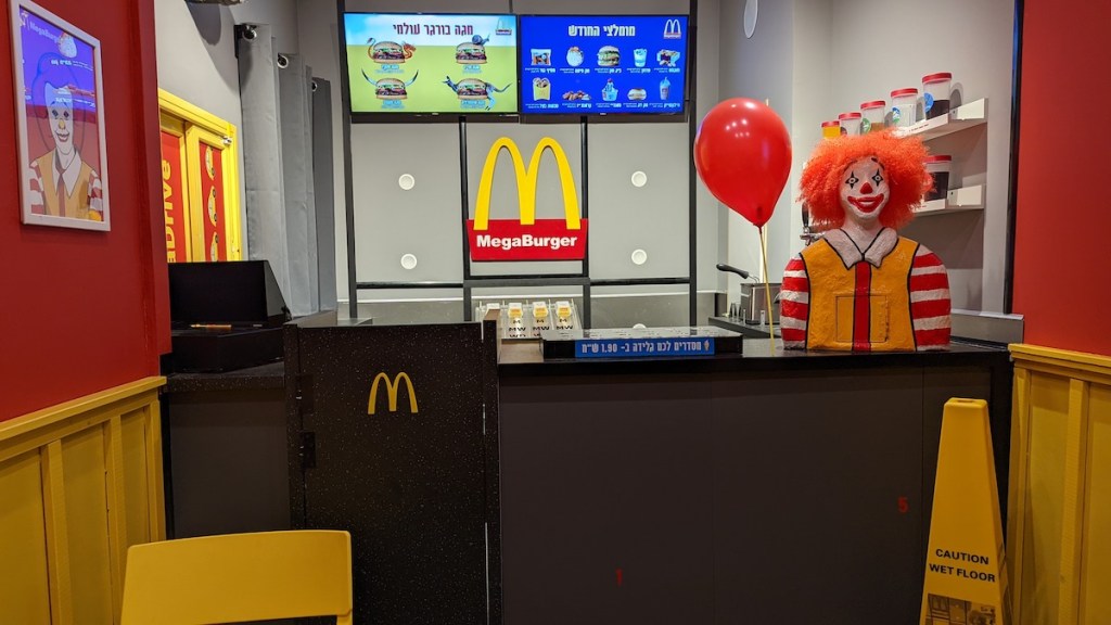 A McDonalds-esque MegaBurger counter with a frightening clown statue.