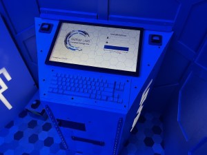 Inspire Labs computer terminal in a blue-lit room.