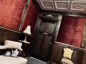 A luxurious room in the Titanic with a tea set out. The room is tilting.