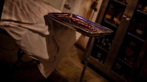 An operating theater with bloodied equipment on a steel tray.