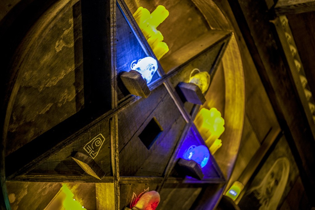 A pentagram with glowing orbs and candles.