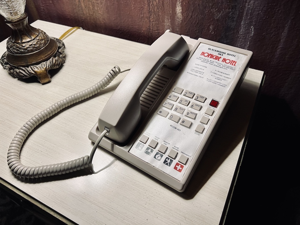 Closeup of a phone for the Homicide Hotel.