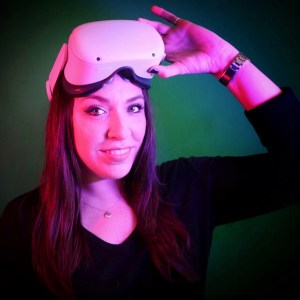 Cara Mandel wearing a VR headset on her head.