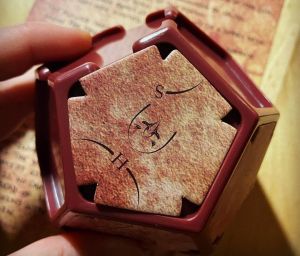 Closeup of a red geometric physical puzzle.