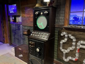 A machine with many knobs and an interface that looks like green electricity.