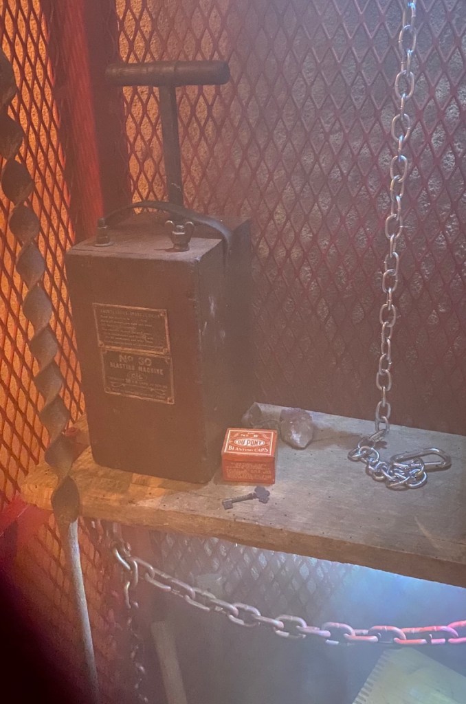 A gated area within a mine that stores equipment. Explosives and a key.