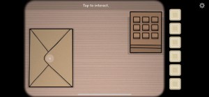 A wooden table with a 9 digit, unlabeled keypad beside an envelope.