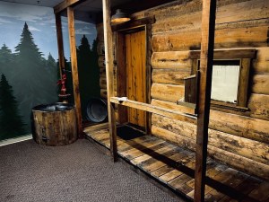 The exterior of a log cabin.