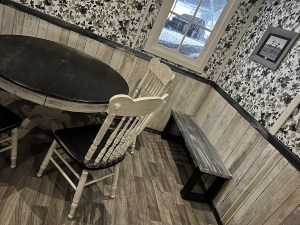 A black & white set of an old kitchen in a farmhouse.