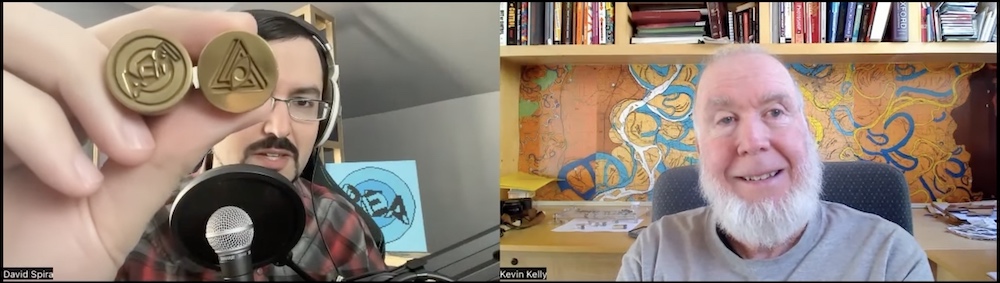 David showing Kevin Kelly a pair of brass wax sealing stamps with the REA & RECON logos. 