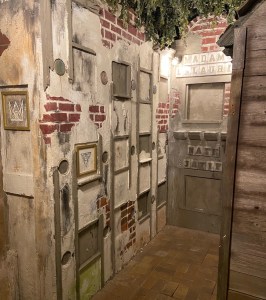 An old, weathered brick mausoleum.