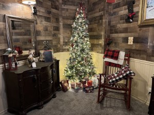 An elegant Christmas scene with a beautifully decorated tree in the middle.