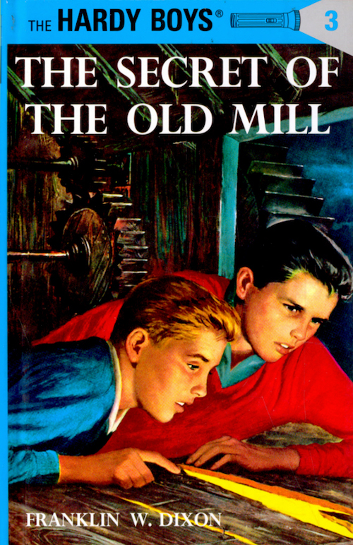 Book cover for, Hardy Boys, "The Secret of the Old Mill," shows the boys sneaking in an old wood building, peering through a crack in the floor. 