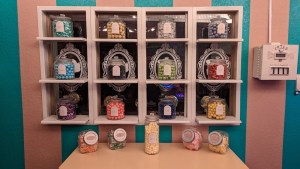 Small shelves with colorful candies on display.