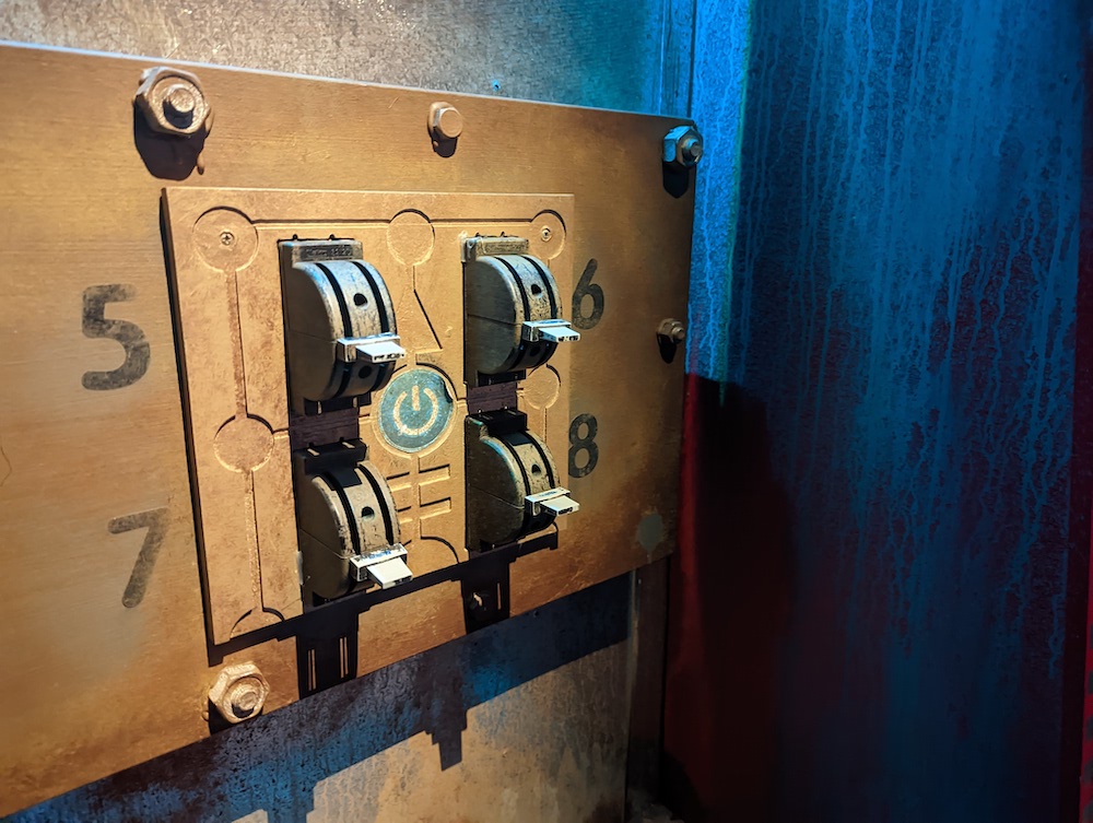 Closeup of 4 power control switches labeled 5-8.