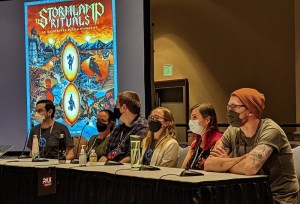 David, Michelle, Mark, Lisa, Rita, and Jack on stage at their PAX Unplugged 2022 tabletop gaming panel.