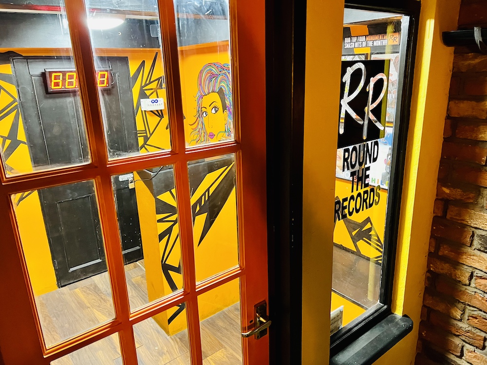 A colorful record store window parodying "Rarekind Records."