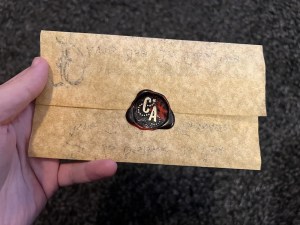 A wax sealed letter, sealed with the Constructed Adventures CA logo.