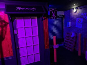 The dramatically lit back-alley entrance to Fenway's Magic Shop.