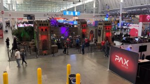 The PAX East 2022 show floor with many large, elaborate booths.