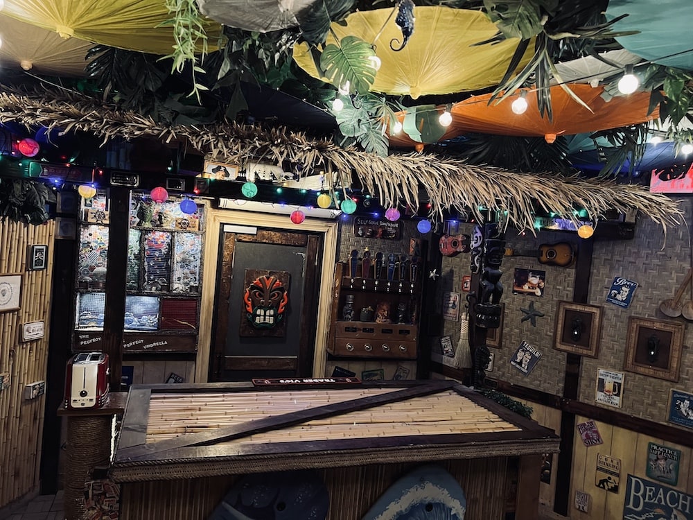 A tiki bar with all manner of decorations.