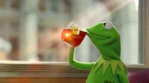 Kermit the Frog sipping a cup of tea.