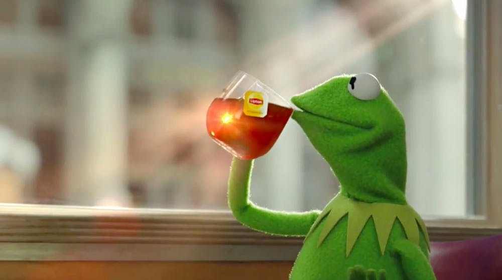 Kermit the Frog sipping a cup of tea.