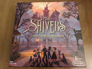 "The Shivers" box art features an illustration of a family approaching an old mansion.