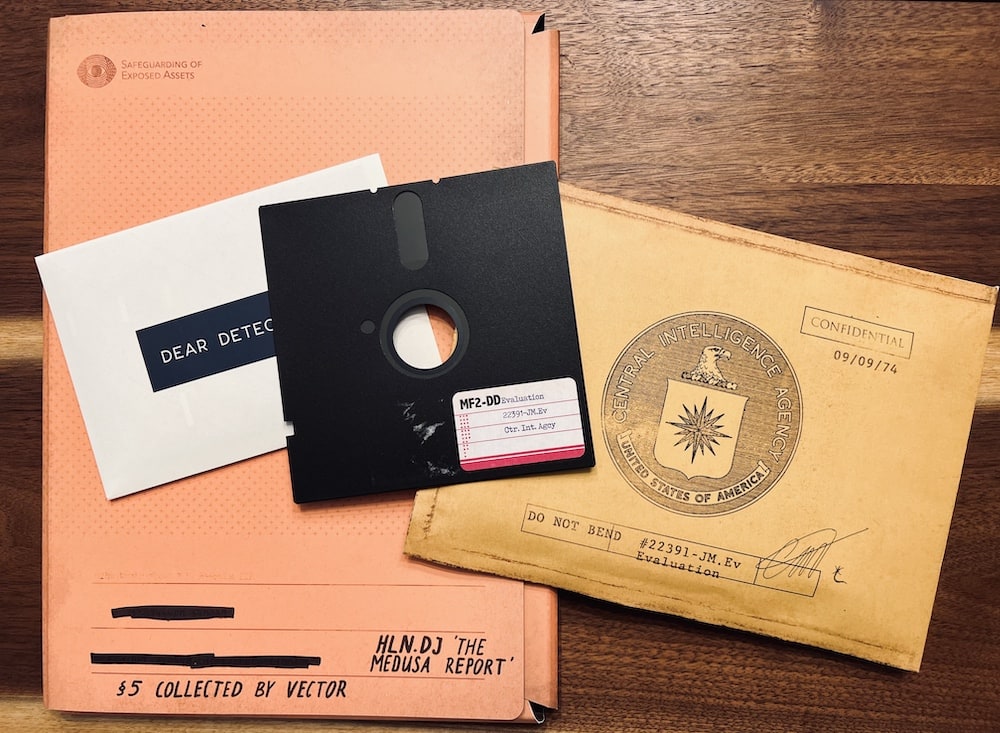 "Medusa Report" case file, a confidential envelope from the CIA, and a floppy disk.