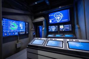 A bank of computers in the control center for Jurassic World.