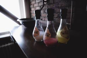 3 bottles with tinctures on a barber's table.