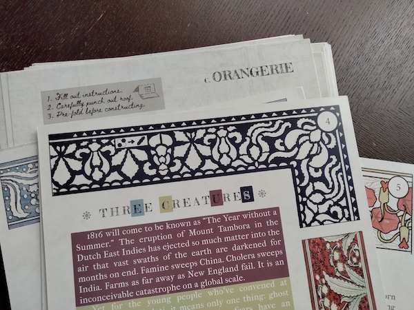 A stack of documents decorated with colorful artwork