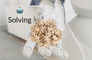 3D rendering closeup of a humanoid robot holding a pile of jigsaw puzzle pieces. Text reads, "Robot emoji solving."
