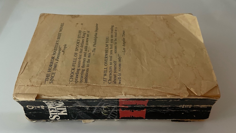 An old, very worn copy of Stephen King's IT missing it's cover.