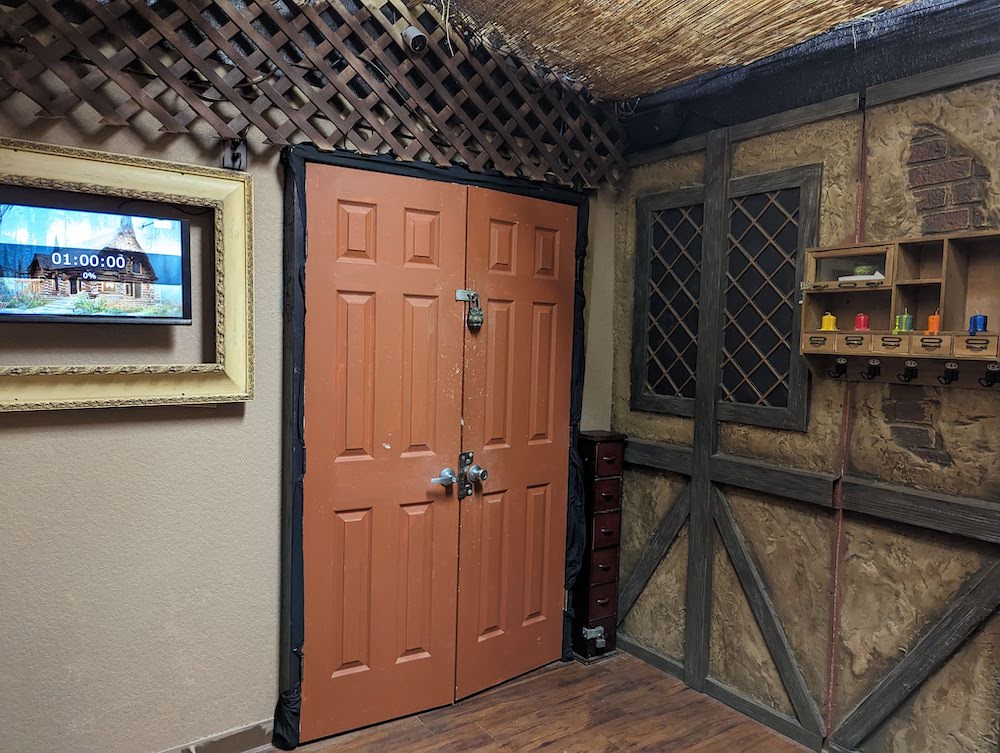 A double door held closed with a large lock.