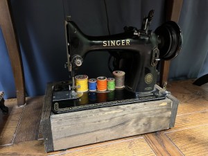 Closeup of a singer sewing machine.