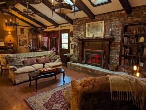 A magnificent living room with an incredible victorian aesthetic.