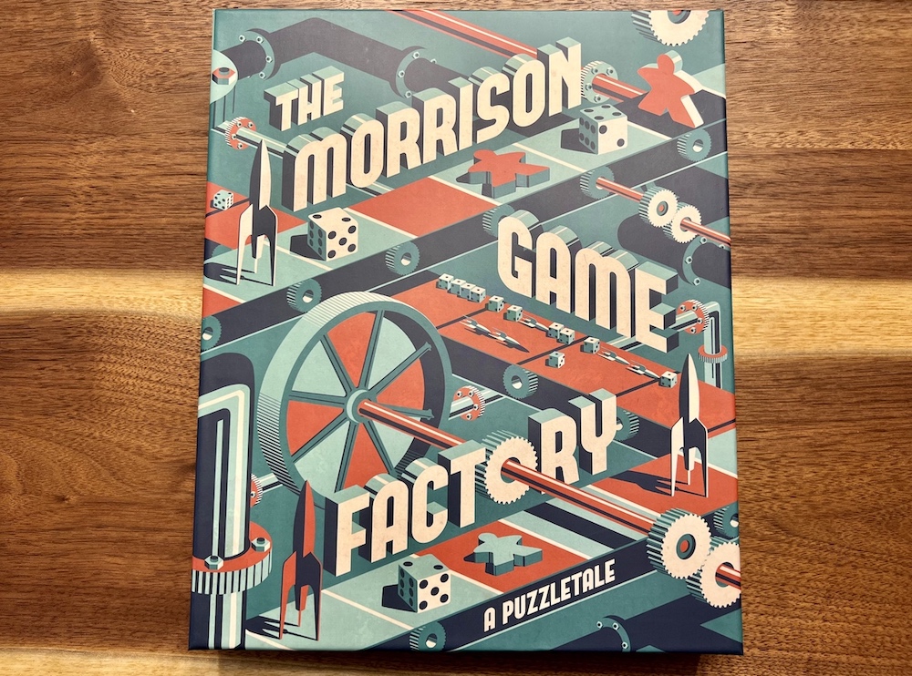"The Morrison Game Factory: A Puzzletale" box ard depicts a playfulretro factory with game components on a conveyor belt.