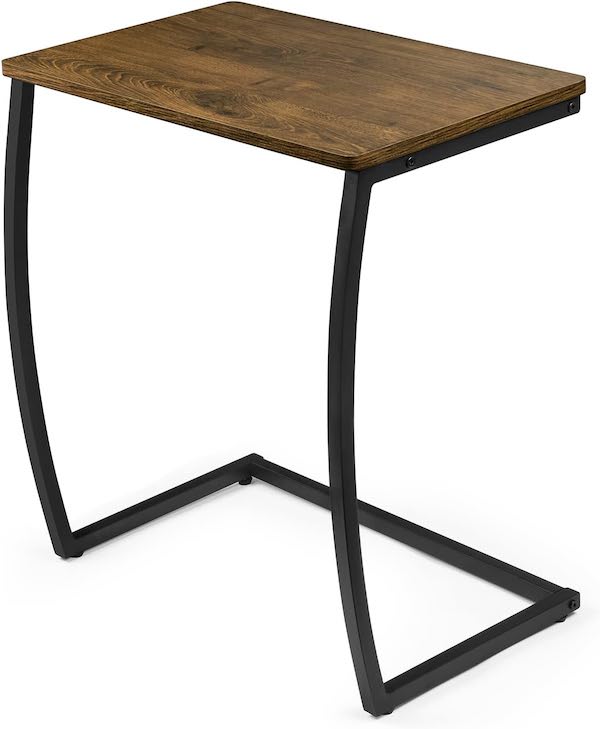 A wood-topped couch table with a C shaped metal frame.