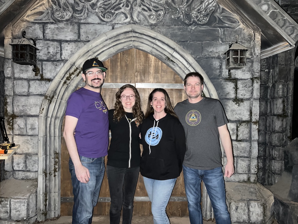 David, Lisa, Heather, and Richard standing in front of the doors of Forgotten Cathedral.