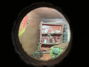 View through a peephole into a tiny room.